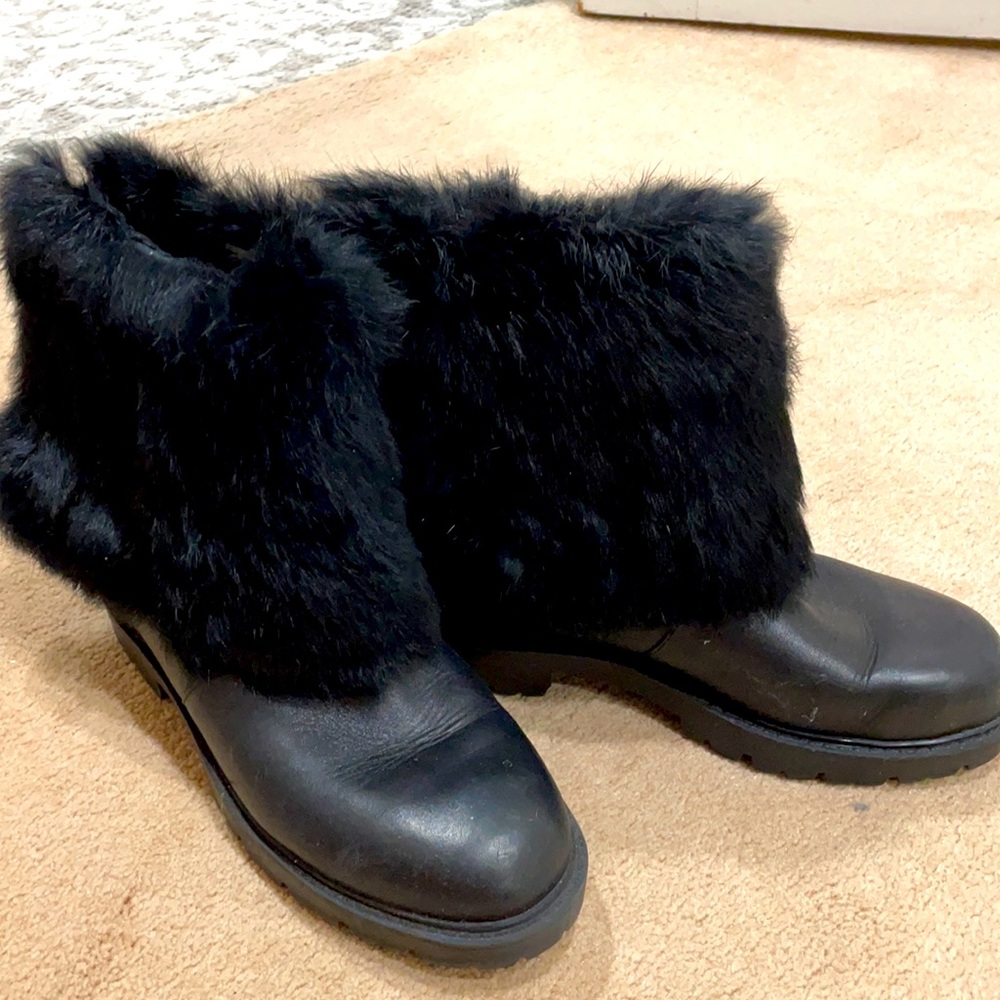 Black leather and real fur booties with black rubber lug soles. Slip right in!
